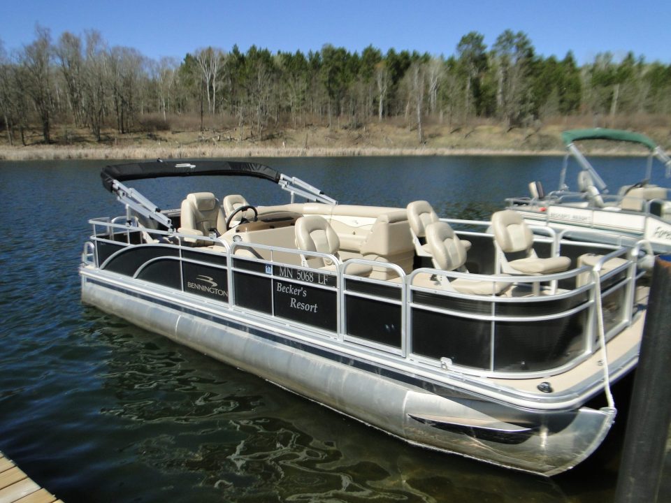 Bennington pontoon boat docked at Becker's Resort Minnesota