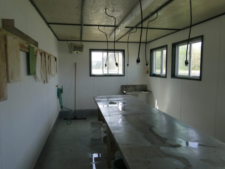 Interior of a utilitarian work shed with wet countertop